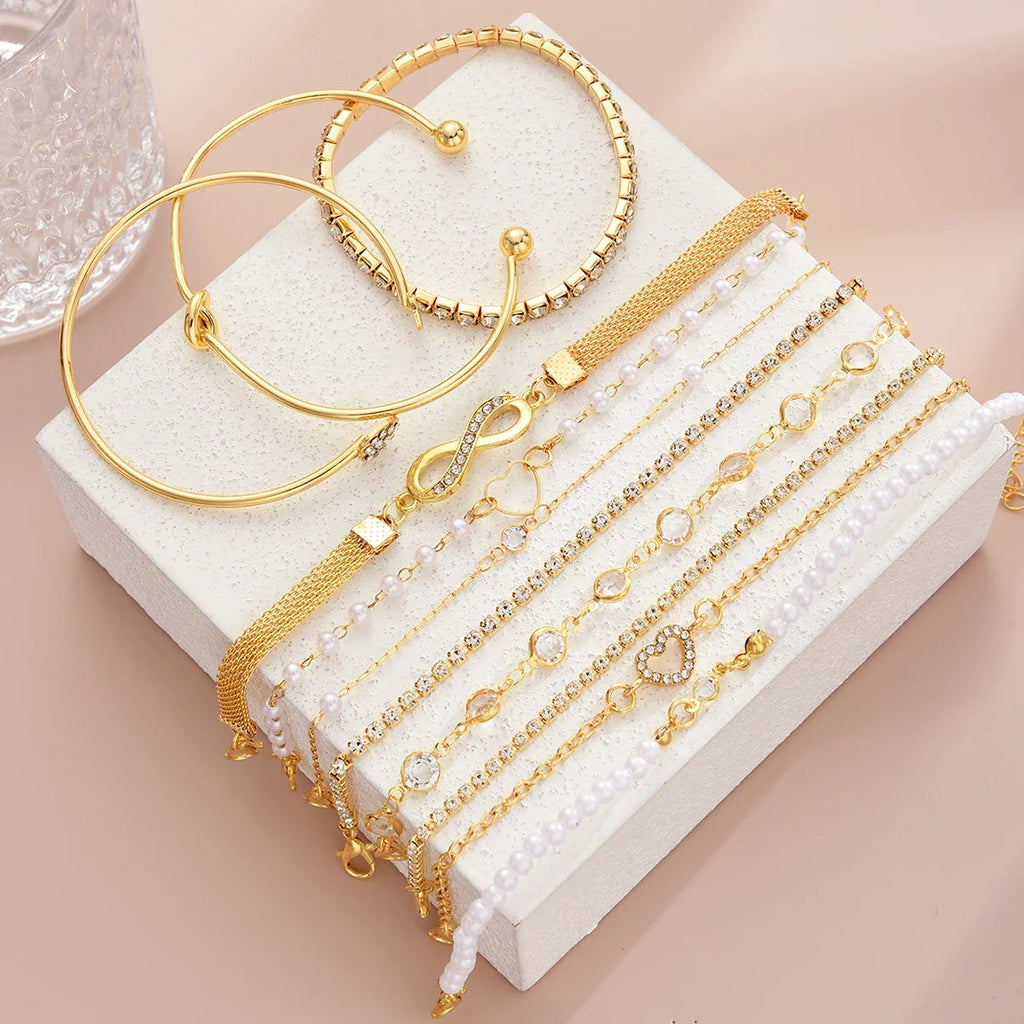 Amélie eleven-piece gold bracelet set on ivory display — detail 4