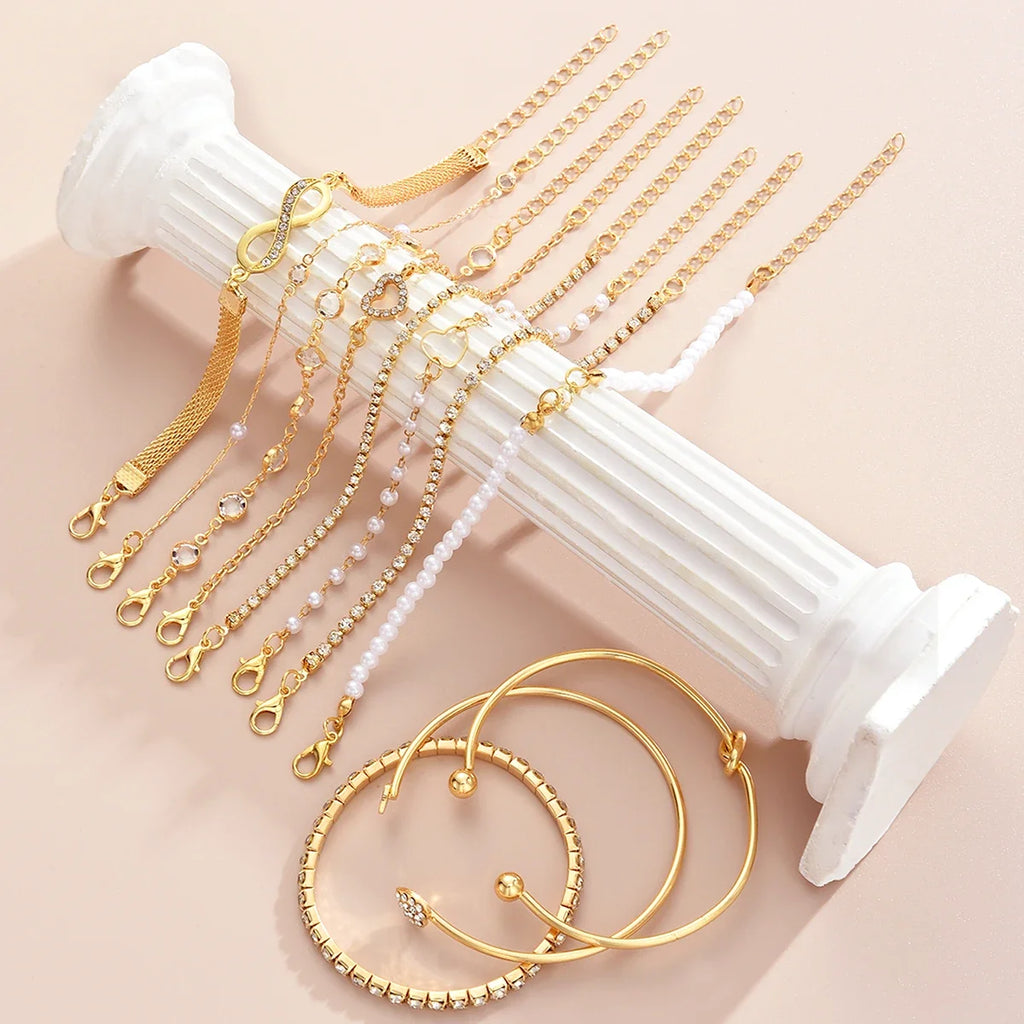 Amélie eleven-piece gold bracelet set on ivory display — detail 3