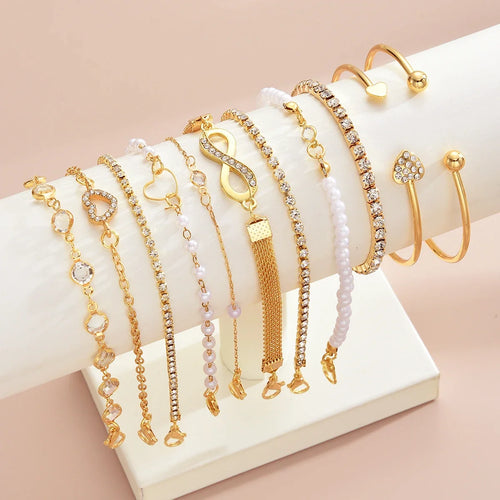 Amélie eleven-piece gold bracelet set on ivory display — detail 2