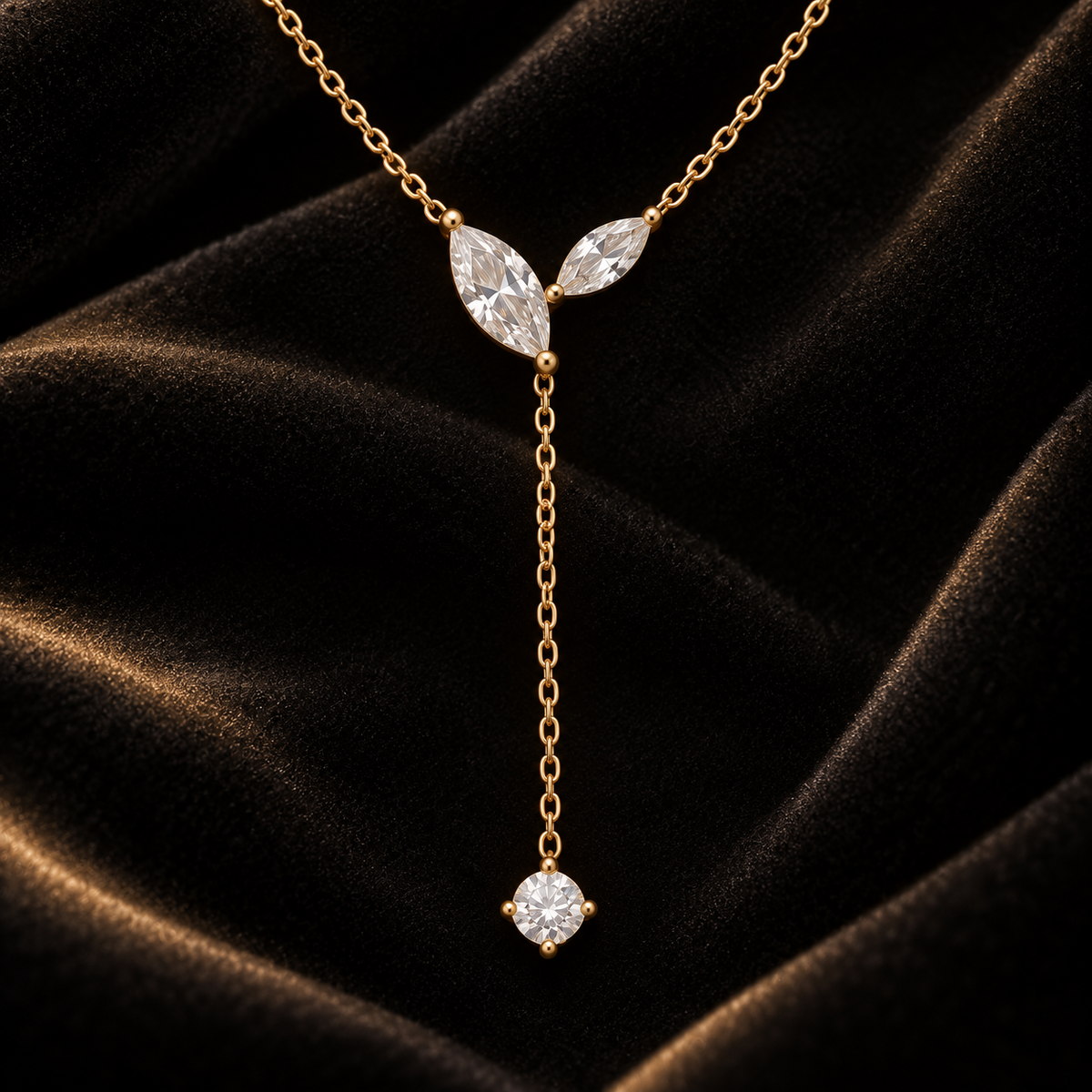 Celeste gold teardrop lariat necklace luxury detail on black velvet