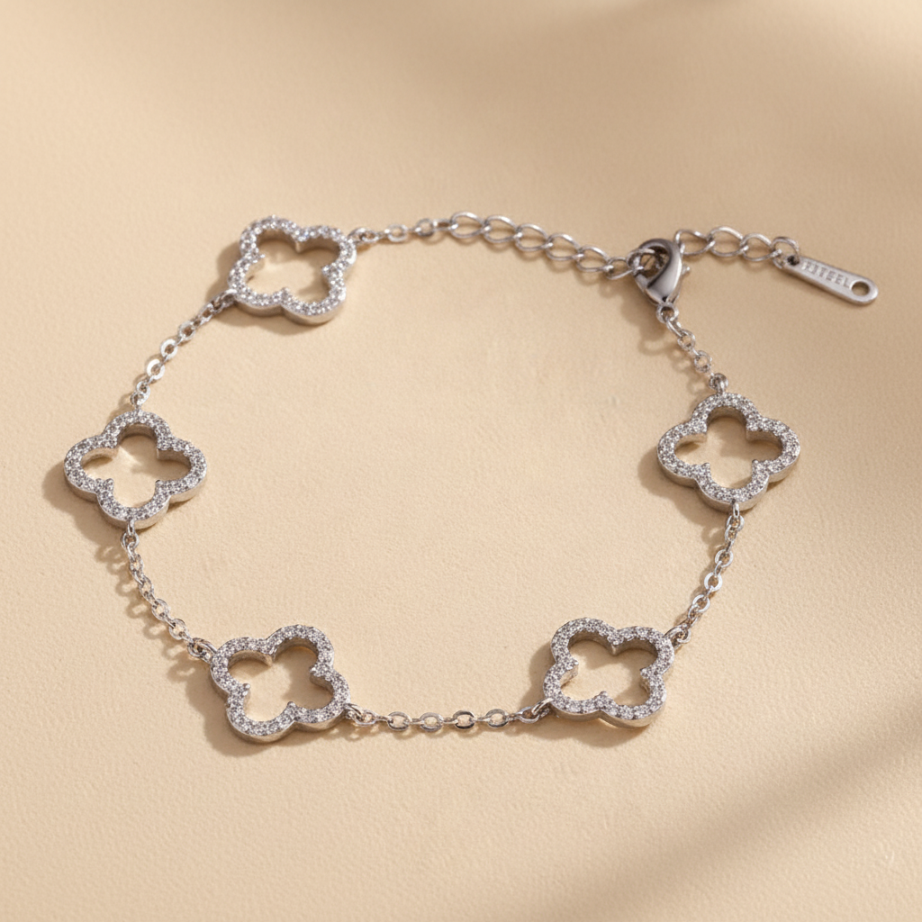 Signature gold clover zircon bangle on ivory stone — detail 4