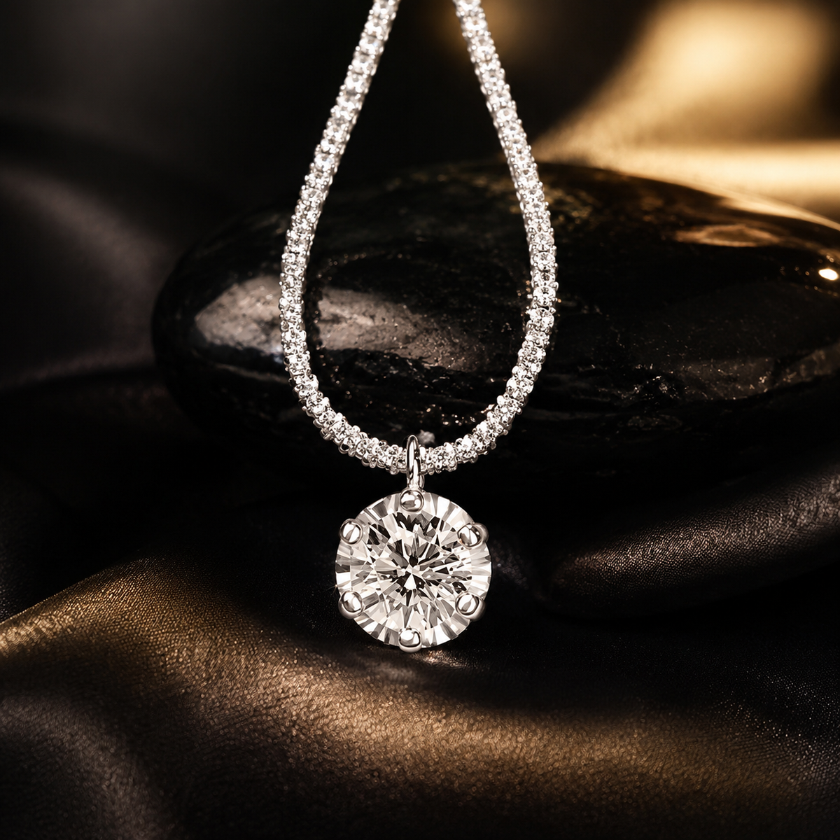 Lumière Solstice silver-tone zircon pendant necklace detail on a black-and-gold background
