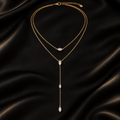 Éclat Marquise layered zircon Y-drop necklace on black satin