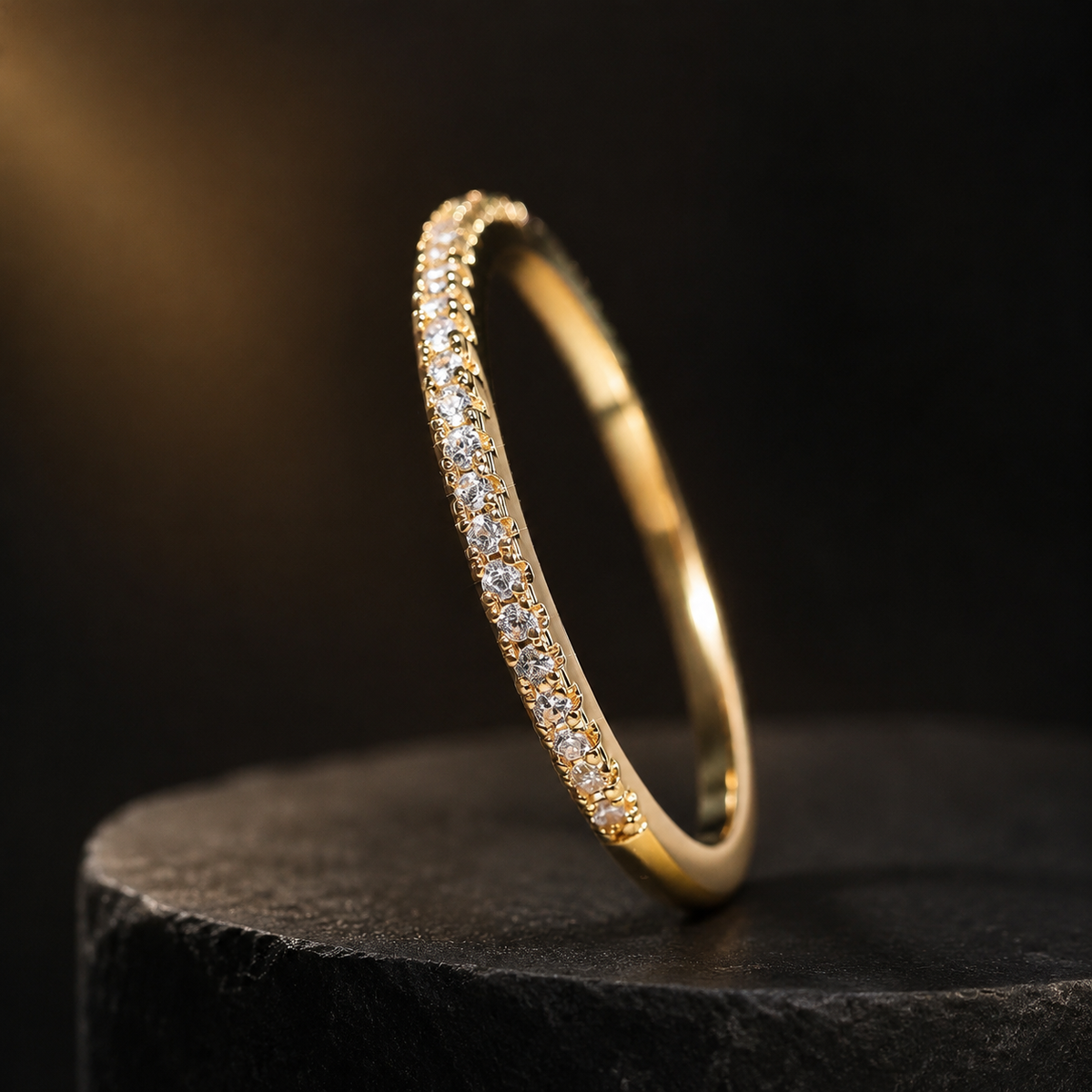 Élan minimalist zircon band ring on black and gold background