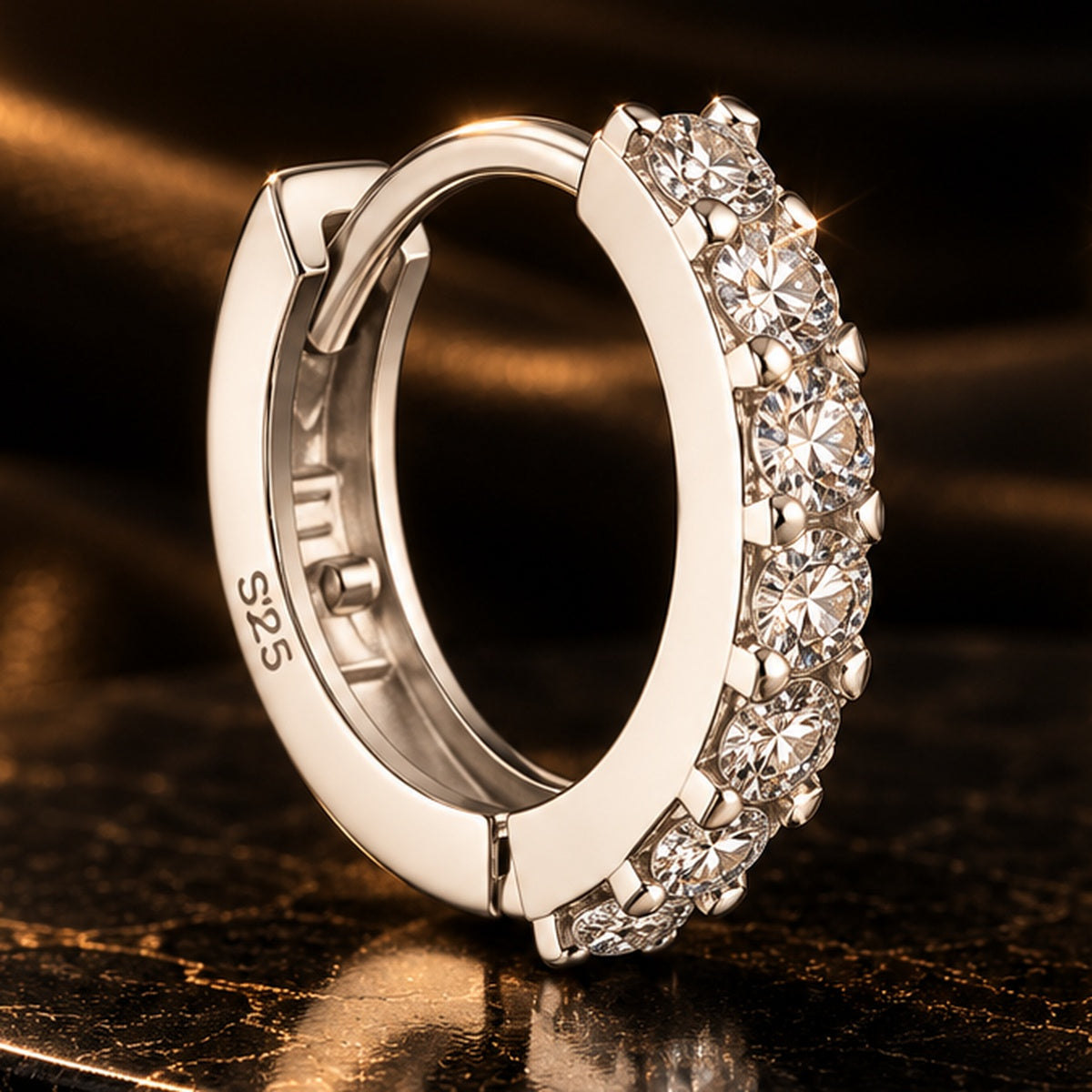 Close-up of Lumière Cubic Zirconia Hoop Earrings on a dark luxury background