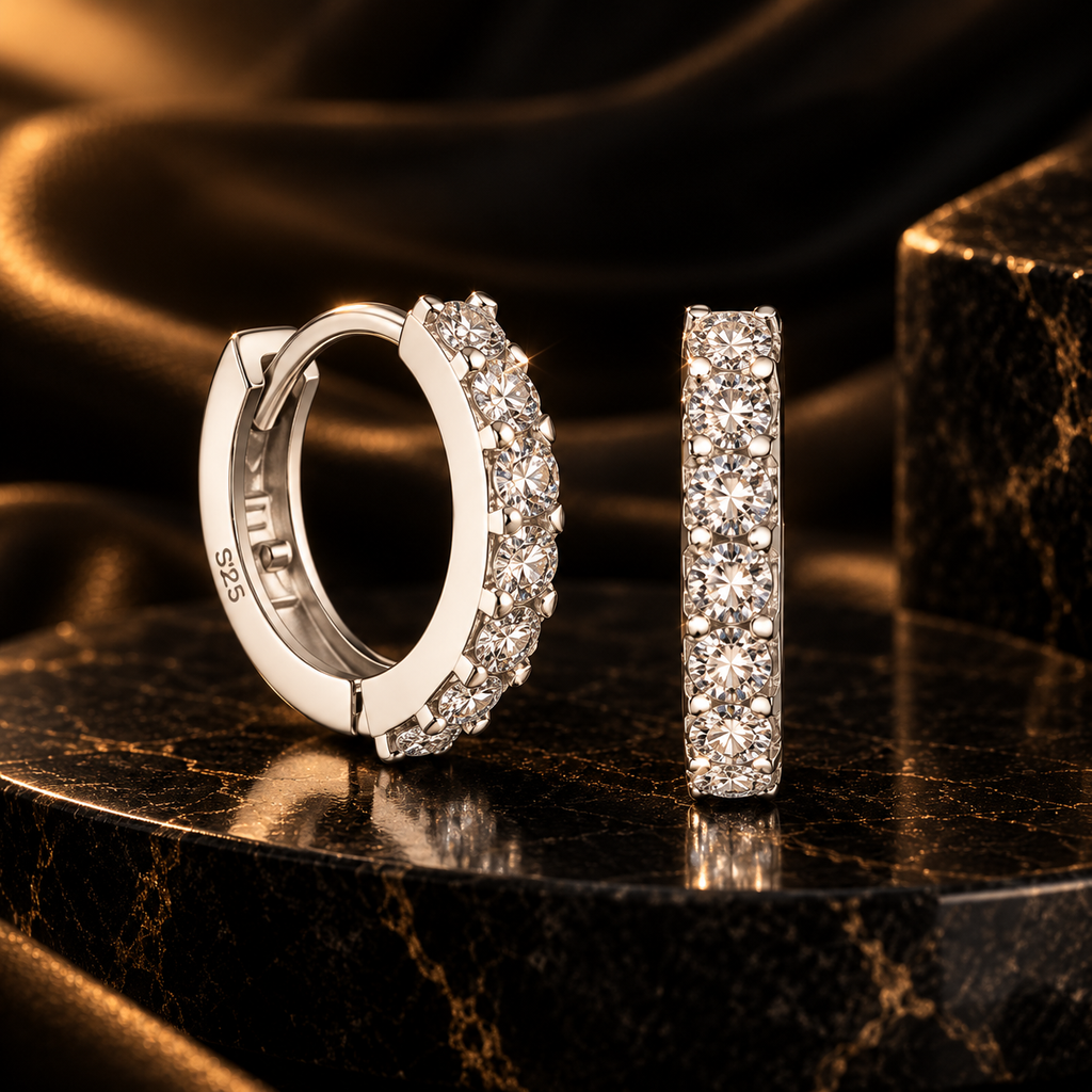 Lumière Cubic Zirconia Hoop Earrings on dark marble with warm gold lighting